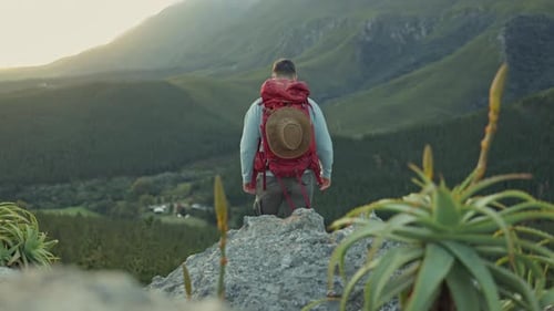 Man, celebration and mountain with hiking, nature and achievement with view