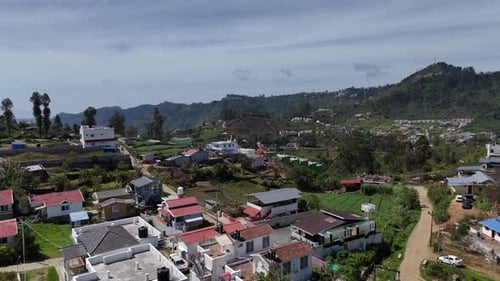 Mist-covered hills gradually revealing the charming hill town of Kodaikanal.