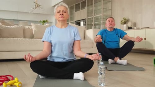 Senior Couple Practicing Meditation at Home