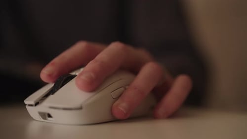 Hand Using Computer Mouse Device in Office Environment