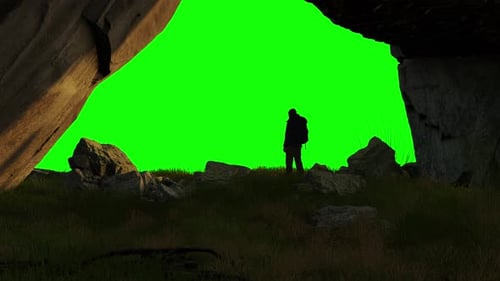Adventure Man Hiker Standing in an Ice Cave on Top of Mountain Composite Cutout with Green Screen