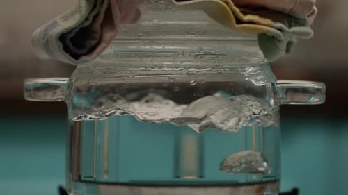 Adding Sea Food Into Boiling Water in Transparent Saucepan in Slow Motion