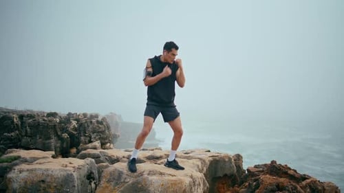 Strong Male Boxing Outdoors on Cliff Professional Boxer Training Before Fight