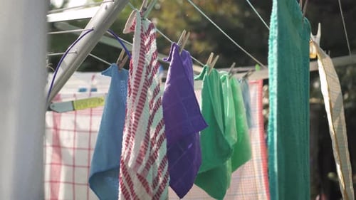 Towels Pegged Onto A Clothes Line On A Sunny Day. - close up