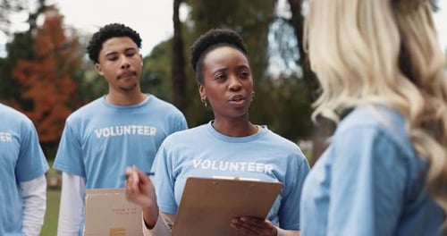 Diverse Group of Volunteers Working in Urban Park