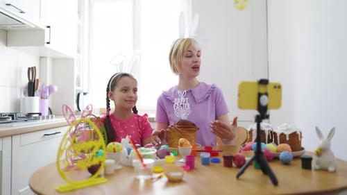 Woman and Girl Decorate Easter Cakes for Video