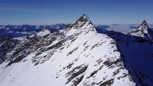 Aerial flight above stunning Alps.