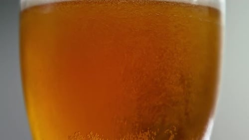 Refreshing Glass of Golden Beer with Bubbles