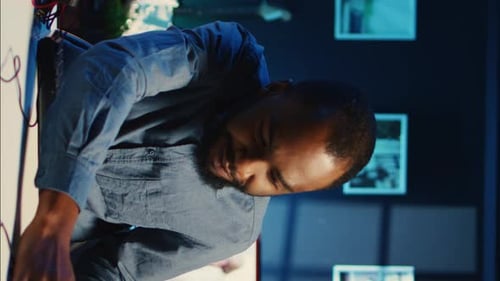 Adult Presenting Computer Keyboard in Vertical Format