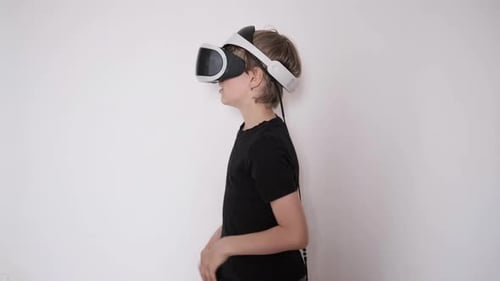 Child Interacting with VR Headset at Home