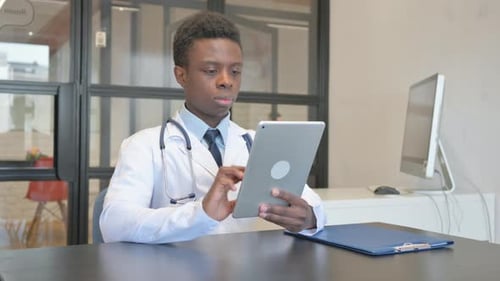 Doctor Using Tablet in Office Setting