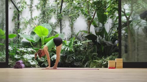 Auburn Haired Woman Doing Yoga in Green Space