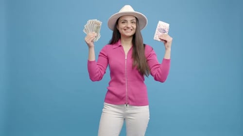 Woman Holds Money and Gift Bag in Studio