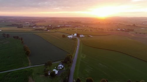 Sunrise Aerial Over Verdant Farmland Landscape