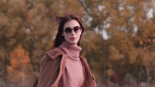 Stylish Woman Wearing Sunglasses Outdoors on Autumn Day
