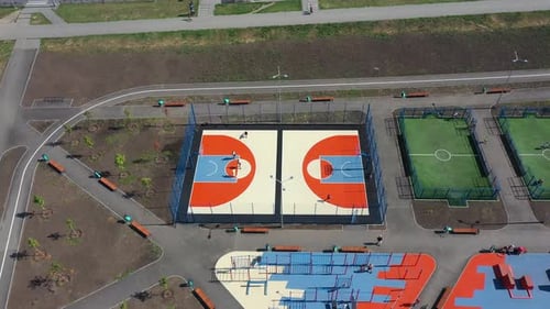 Aerial View on Contemporary Sport Grounds at Urban Park at Summer Day Youth Teenagers and Child