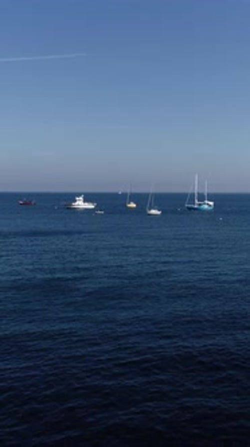 Vertical Video of Boats in the Blue Sea
