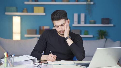 Businessman working from home is stressed and overwhelmed with work.