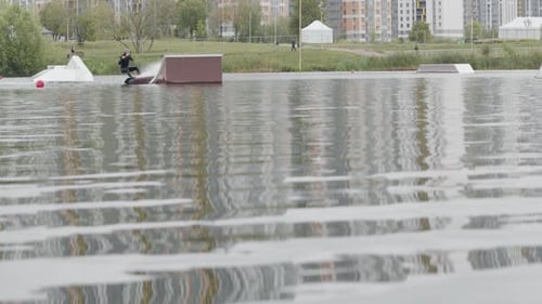 Man Wakeboarding on Lake