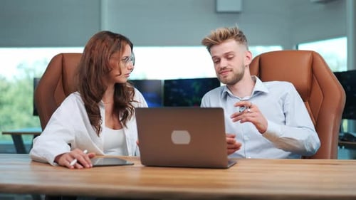 Creative Office Brainstorm: Young Business Team Working with Notebook