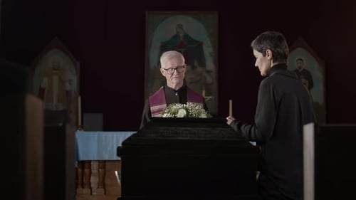 Solemn Funeral Service in Dark Church Interior