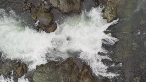 Aerial View of Whitewater Rapids Flowing Down a River in British Columbia, Canada