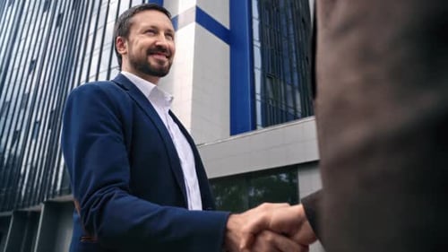 Smiling Business Man Shaking Hands with Partner Colleague Meeting Outdoor at Downtown Office City
