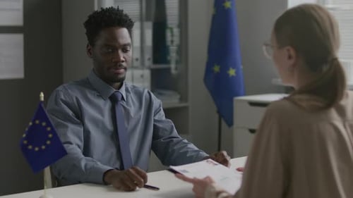 African American Visa Applicant Talking with Consular Officer at EU Embassy
