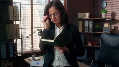 Caucasian Businesswoman Woman Wear Glasses Holding Pen Writing Notes Notebook Business Tasks Office