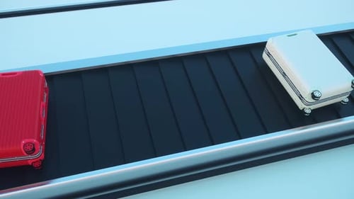 Top view of a baggage carousel with colored suitcases