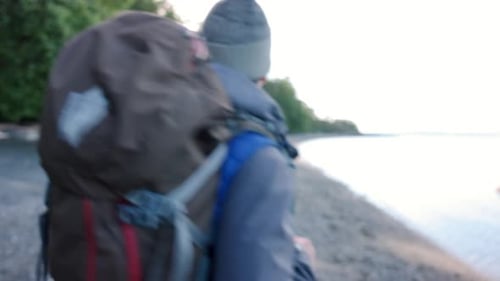 Carefree Man with Backpack Hing on Ocean Beach 4044 Years