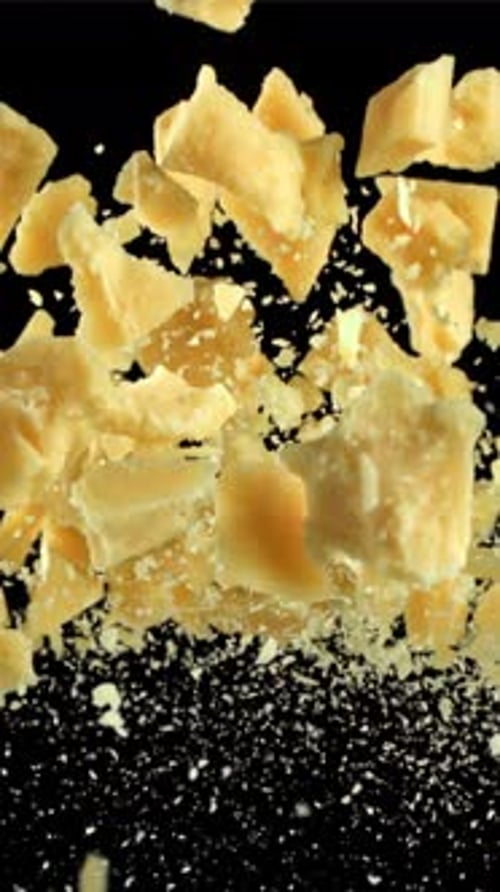 Parmesan Cheese Flies Up and Falls Down Filmed on a Highspeed Camera at 1000 Fps