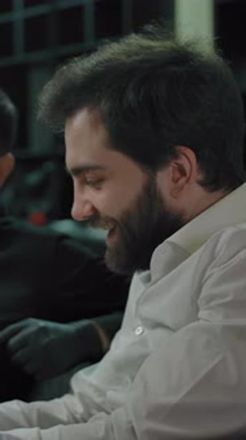 Two Young Adults Looking at a Tablet