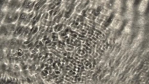 Abstract Rippling Water Surface with Light