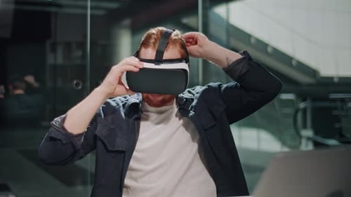 Futuristic Workflow Man Uses 3D Augmented Reality Glasses in Modern Office