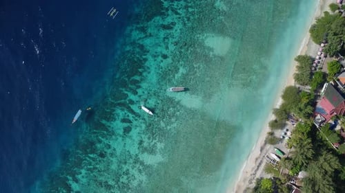 Drone shot of the blue water off Indonesian coast line