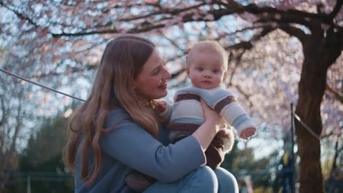 Mother And Child Under The Cherry Trees