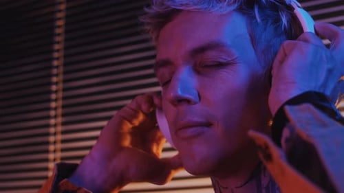 Man Listening to Music on Headphones, Close Up