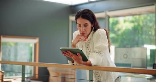 Woman Using Tablet Indoors at Home