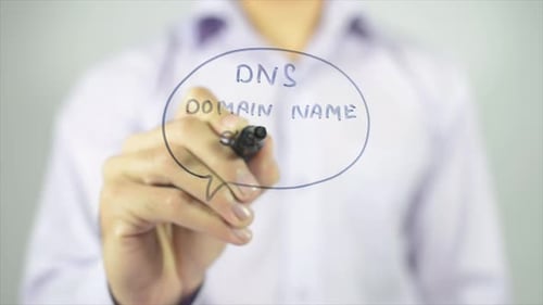 Man Writing DNS Domain Name System on Glass