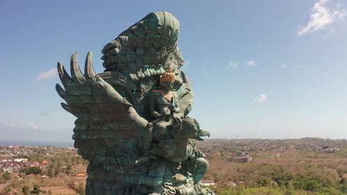 Garuda Wisnu Kencana Cultural Park flying around object building close up perspective. Beautiful Bal