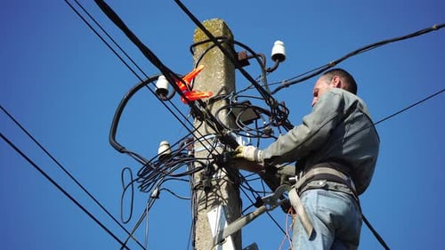 Electrician Working on Power Line