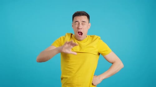 Man Displaying Emotions Against a Blue Background