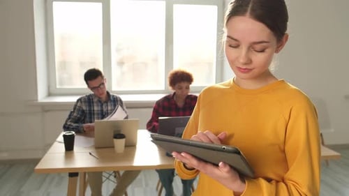 Portrait of Female Team Leader Businesswoman Standing in Office with Colleagues Meeting in
