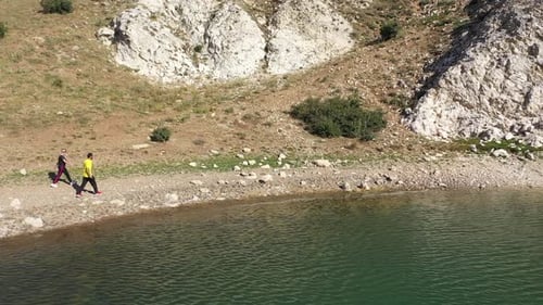 Aerial View Of Man And Woman Walking By Lake 2