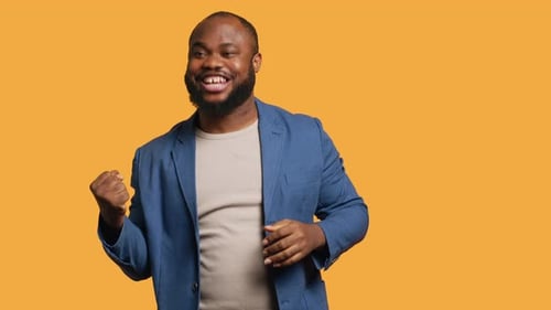 Portrait of Joyful Man Celebrating Studio Background