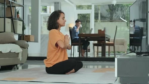 Woman Practicing Yoga Meditation at Home