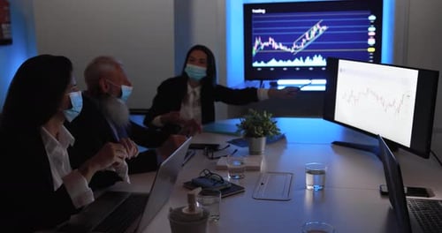 Business woman explaining trading strategies at bank meeting wearing face mask