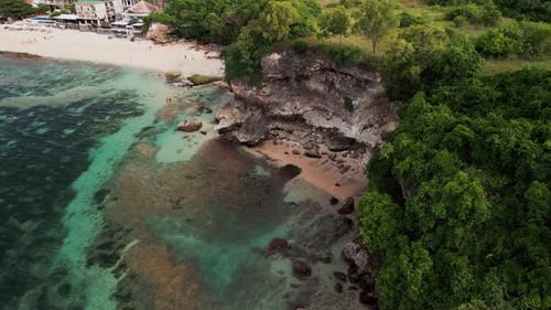 Drone Perspective of Balangan Beach Bali Highlighting Turquoise Lagoon and Snorkeling Spot