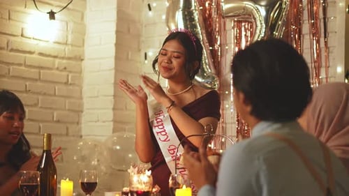 Woman Celebrates Birthday With Her Friends Indoors